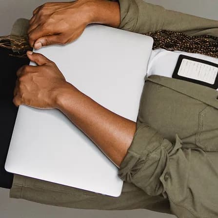 Cbayt team member holding a laptop